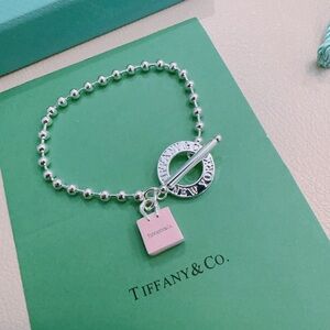 Tiffany & Co. Silver Bracelet with Pink Charm